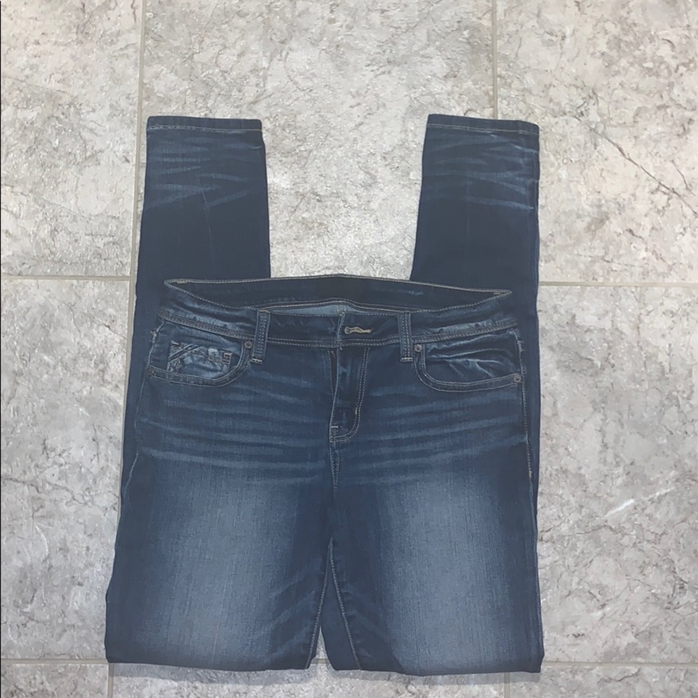 Buckle black skinny jeans